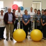 Photograph of physiotherapy staff members from Lincoln County Hospital with two patients.