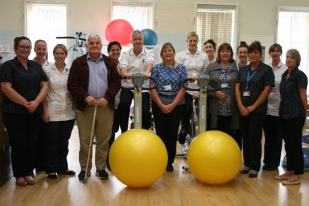 Photograph of physiotherapy staff members from Lincoln County Hospital with two patients.