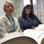 Photograph of Susan and Rebecca with their index books.
