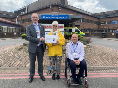 Pictured are (L-R): Chief Executive Andrew Morgan, Volunteer Christine Haddock, and Voluntary Service Manager Andrew Tysoe.