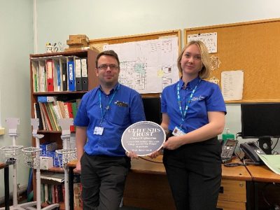 Pictured with their Fab plaque: Tim Evans, Clinical Applications Engineer and Lauren Smith, Trainee Medical Engineer