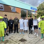Students and NHS staff stood in a group